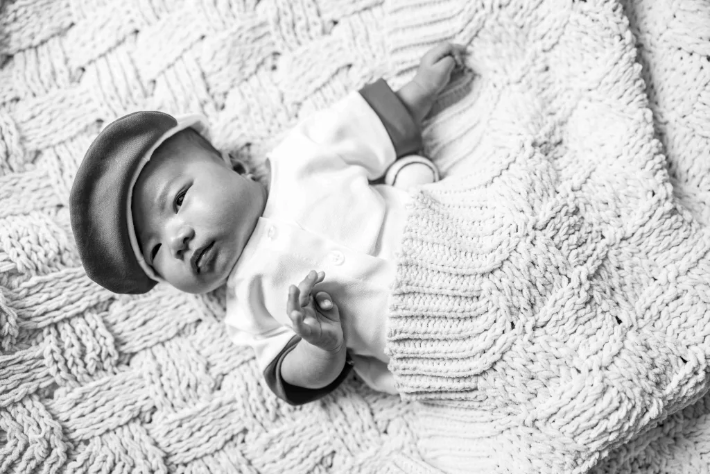 Black and white image of baby Liam taken during his newborn photo session
