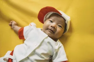 Liam giving a huge smile during his newborn photo session