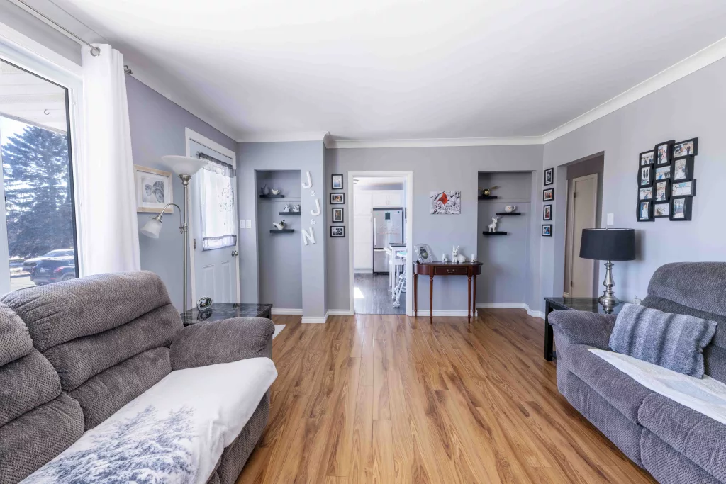 A large living room, with hardwood floor in a thunder bay home