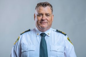 Headshot of an EMS responder in uniform with a clean white backdrop, captured for an award recognition in Thunder Bay.