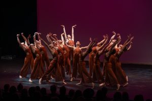 Group of dancers performing on stage