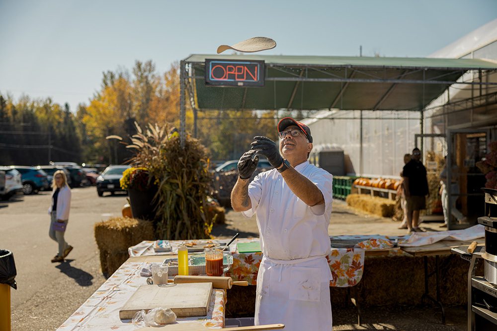 Small business advertising photos of food vendor flipping pancakes at outdoor craft fair event