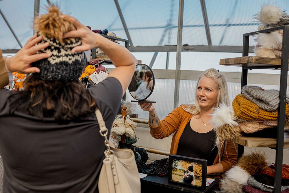 Event photography capturing customers enjoying outdoor craft fair experience for promotional marketing materials