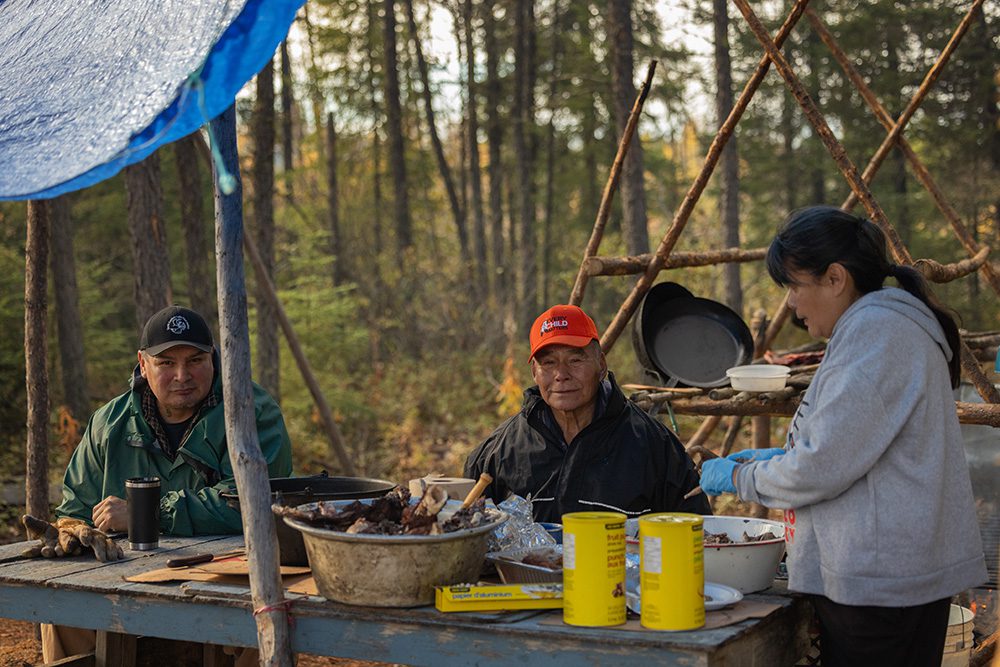 Community members gathered at an outdoor table during the Moose Festival
