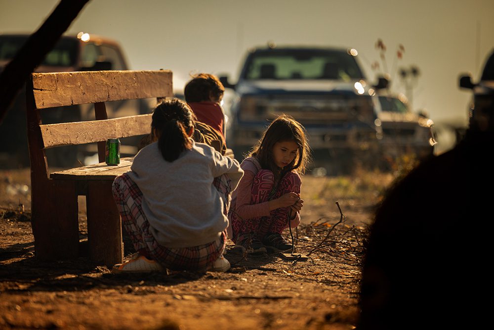 Children playing near a bench during the Moose Festival