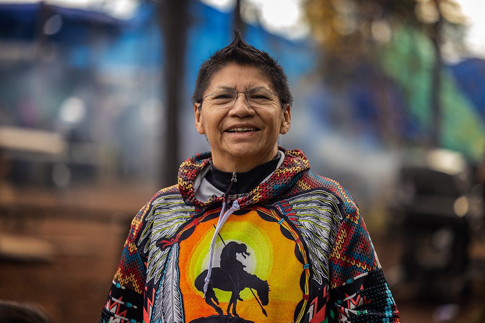 Community member smiling during the Moose Festival at North Caribou Lake