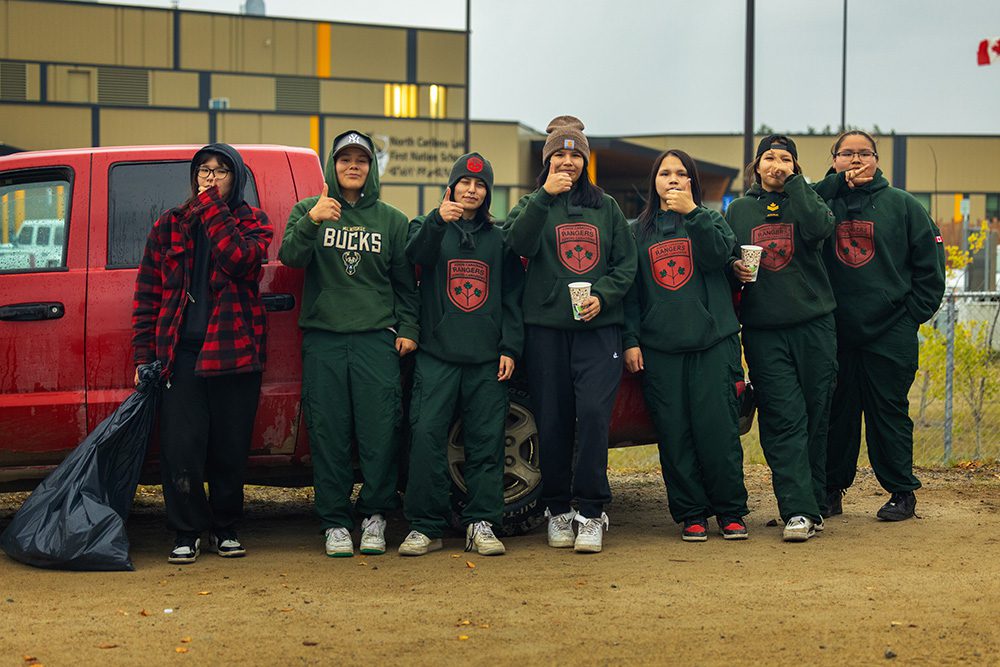 Group of youth standing together during the Moose Festival at North Caribou Lake