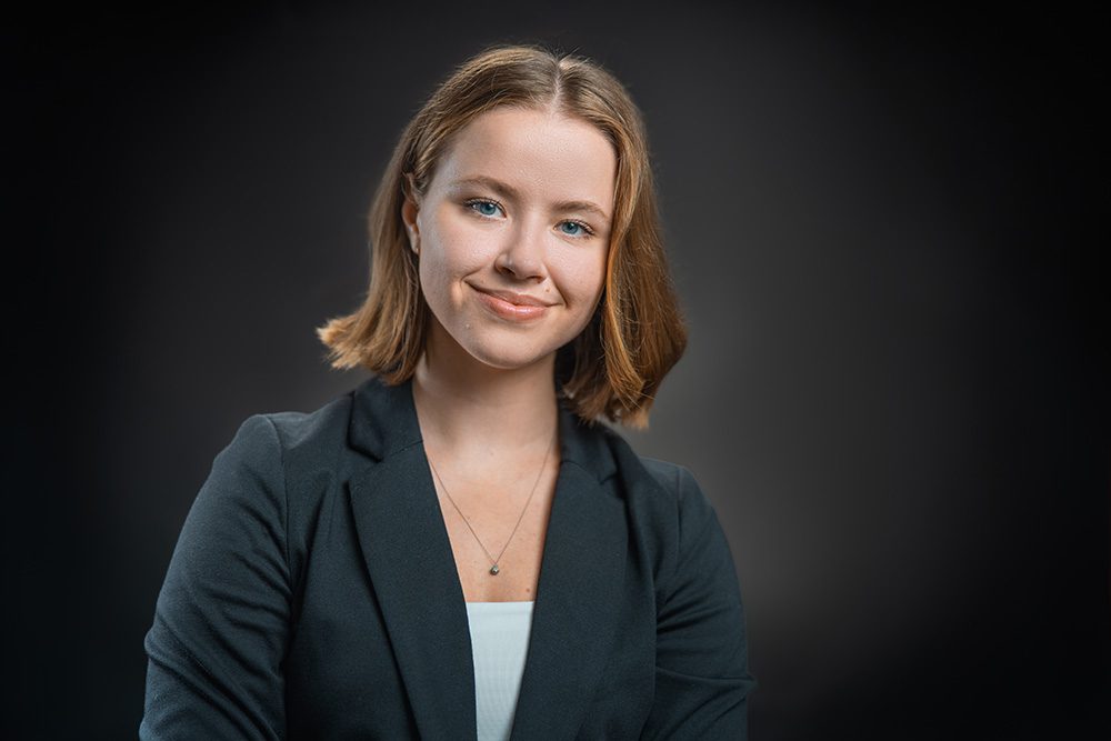 Corporate headshot woman in black blazer professional business photo