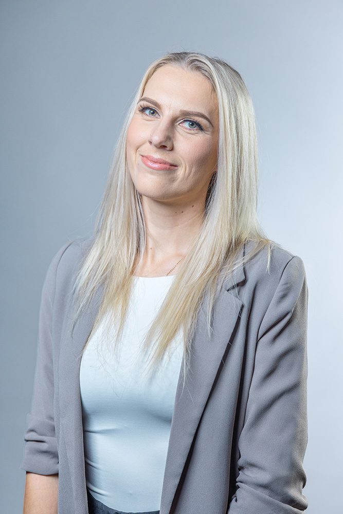 Professional woman headshot gray blazer light background business portrait
