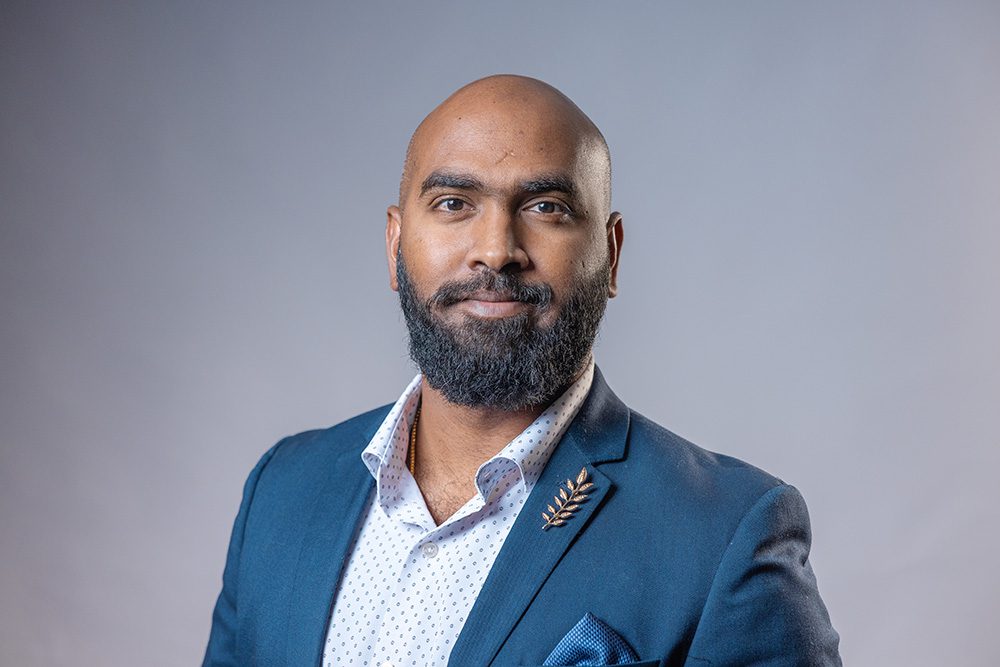 Corporate headshot man teal blazer professional business portrait