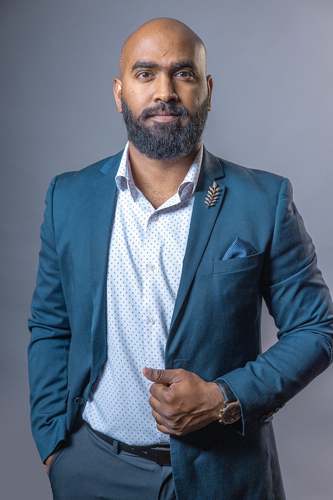 Professional business headshot man teal blue blazer formal corporate photo