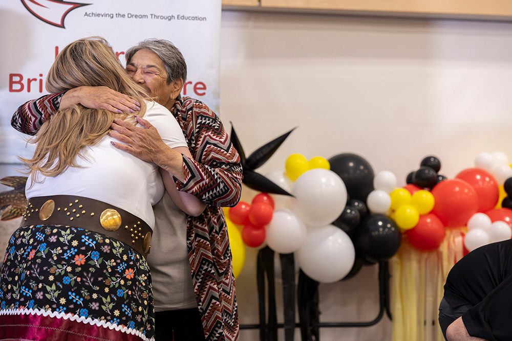 Elder hugging graduate emotional moment professional graduation photography