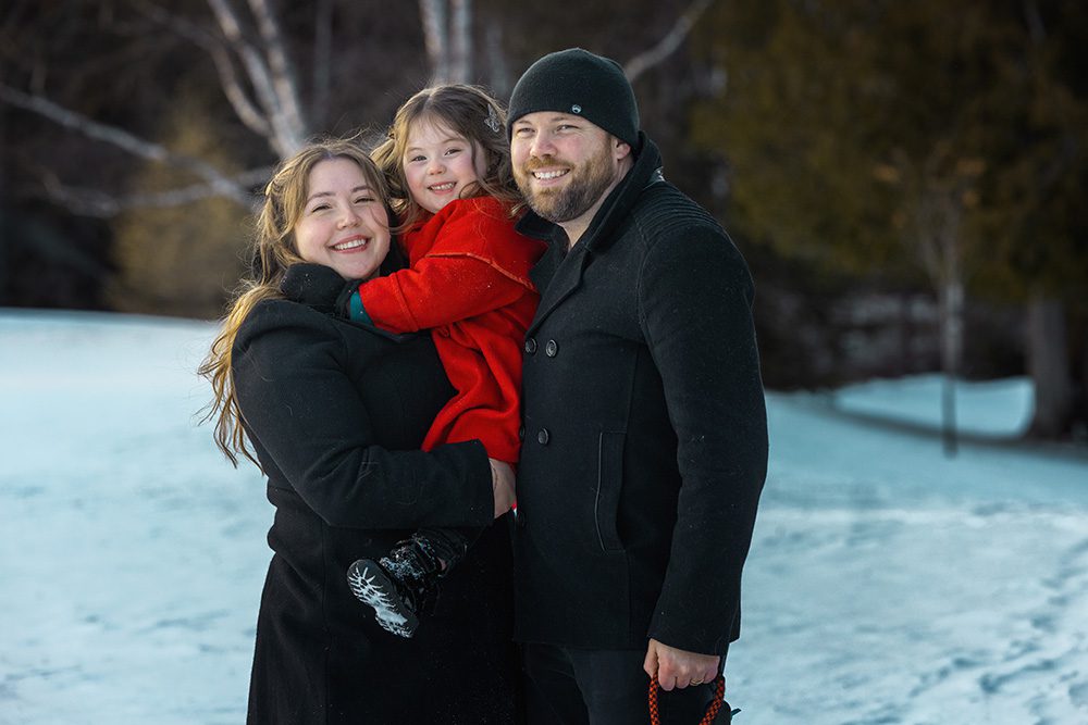 Entire family smiling together during successful winter family photography session