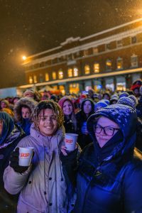 Brand activation event photography showing families enjoying sponsored holiday train event experience