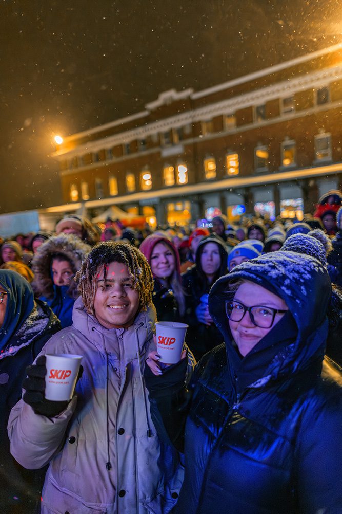 Brand activation event photography showing families enjoying sponsored holiday train event experience