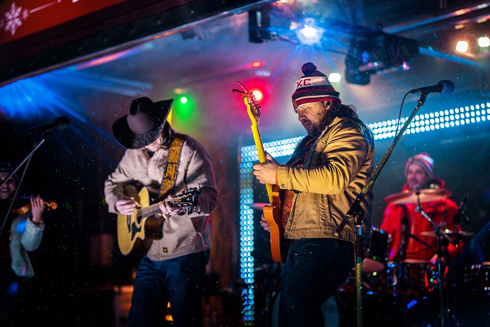 Corporate event photography showing live entertainment at brand activation holiday train concert