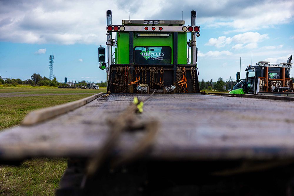 Ground level trucking company photography showcasing Hartley branded tow truck for advertising campaigns